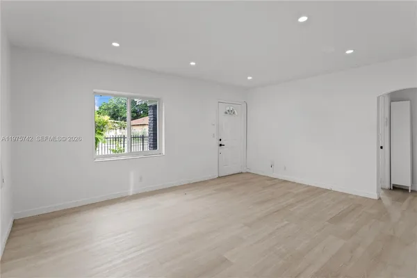 an empty room with windows