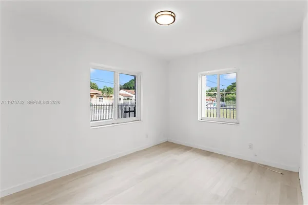 an empty room with windows