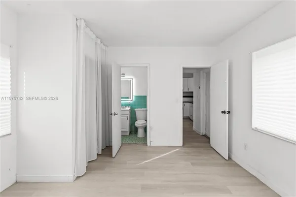 a view of a kitchen with a sink and a cabinet