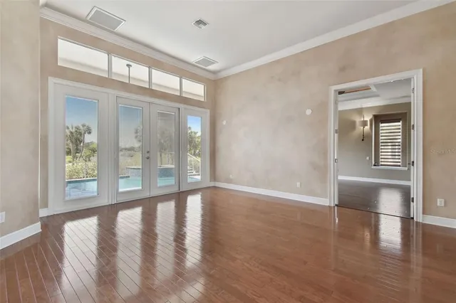 a view of a livingroom with furniture and a flat screen tv