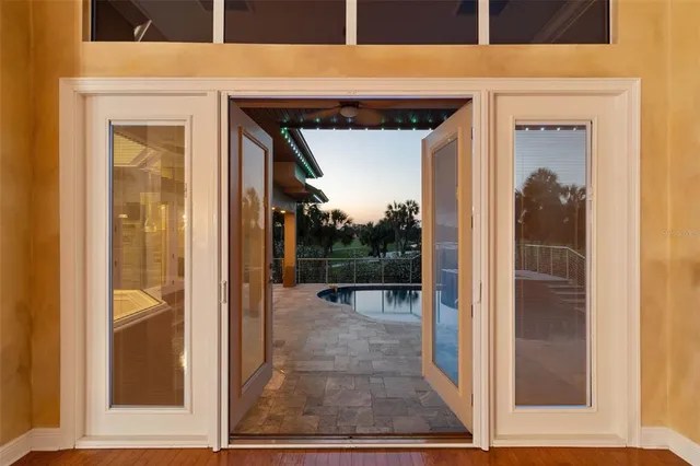 a kitchen with stainless steel appliances granite countertop a sink a stove and a wooden cabinets