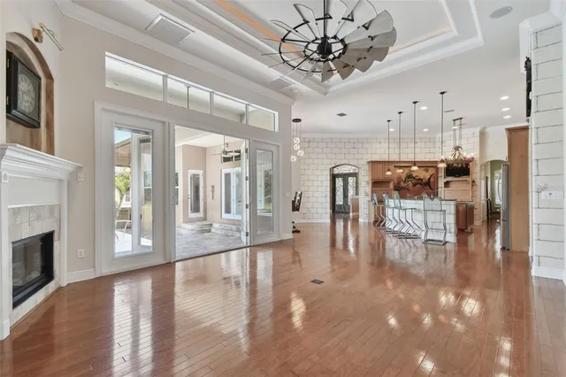 a kitchen view with granite countertop a sink and a window