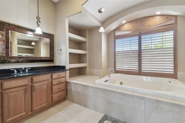 a view of a swimming pool with seating space