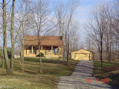 Rustic look with 1.8 Acres. 24x24 garage with new floor and garage door opener.