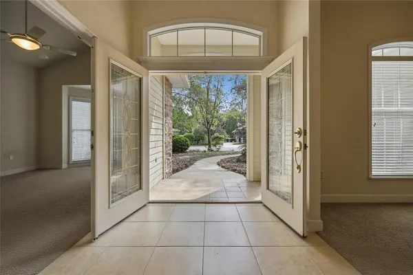 a kitchen with stainless steel appliances granite countertop a sink a stove and a wooden floor