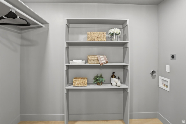 8760 Rustler Road Cottonwood Heights, UT 84093 - Photo 26 of 57 Integrated shelving unit featuring four storage shelves and a lower cabinet space