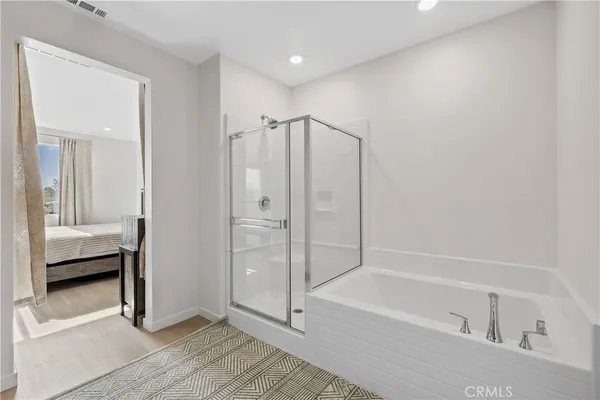 a bathroom with a shower and a tub
