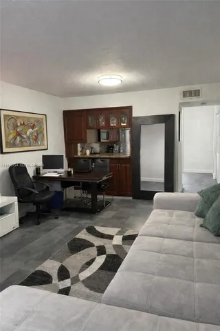 a bedroom with furniture and a piano