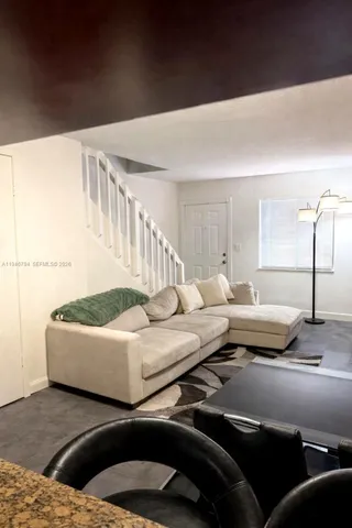a living room with furniture and a couch