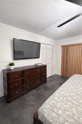 a room with furniture and flat screen tv