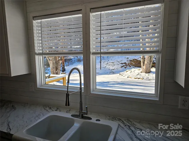 a bathroom with a sink and a window