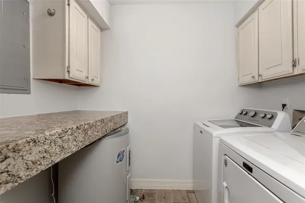 a utility room with washer and dryer