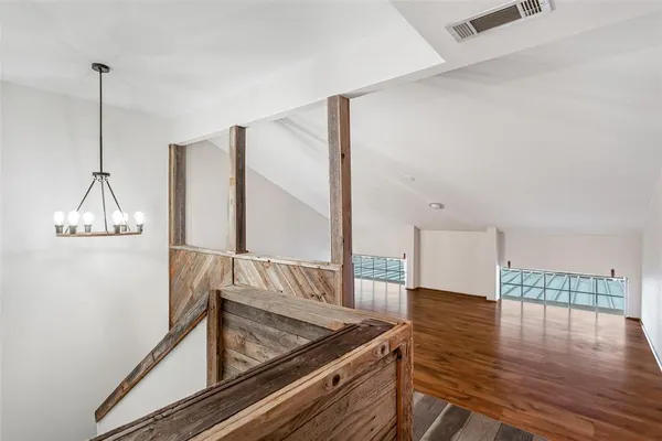 a view of a living room and floor to ceiling window