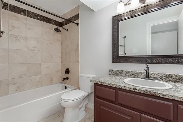 a bathroom with a sink a toilet and a bathtub