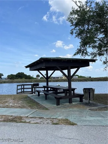 a view of house with outdoor seating