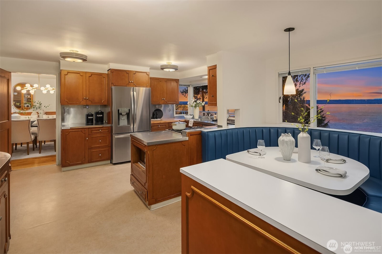 727 Southwest 199th Place Normandy Park, WA 98166 - Photo 14 of 38 a kitchen with a sink a stove and chairs