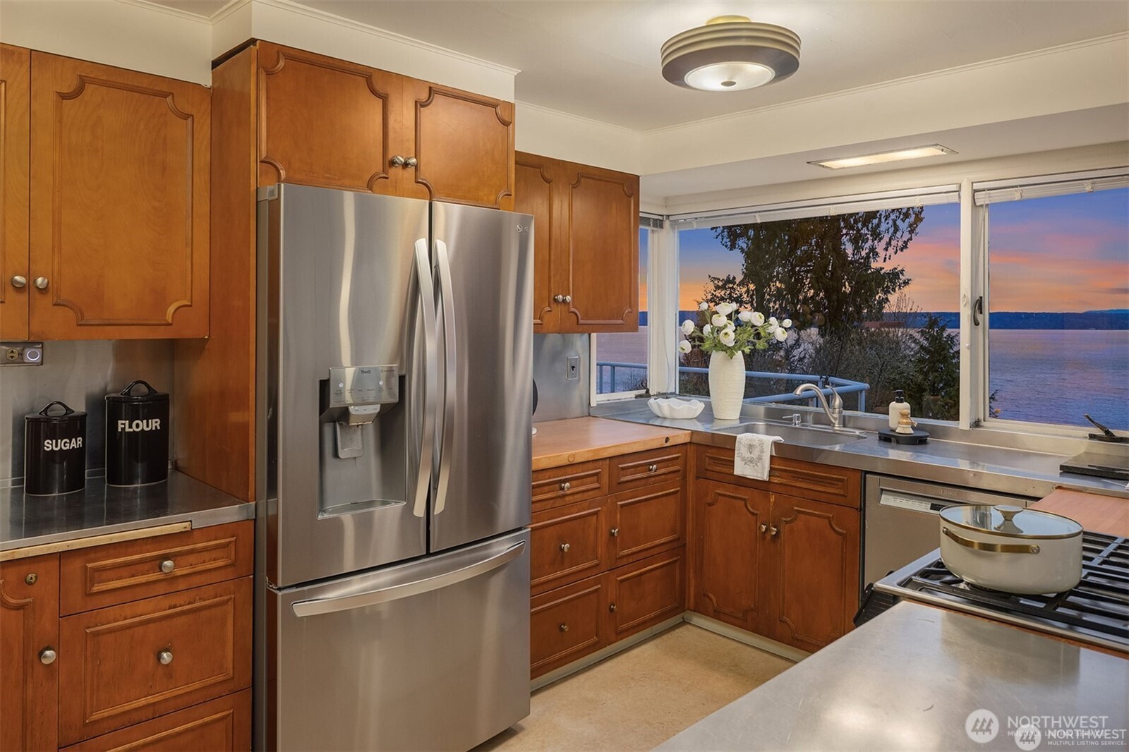 727 Southwest 199th Place Normandy Park, WA 98166 - Photo 15 of 38 a kitchen with stainless steel appliances granite countertop a refrigerator and a sink