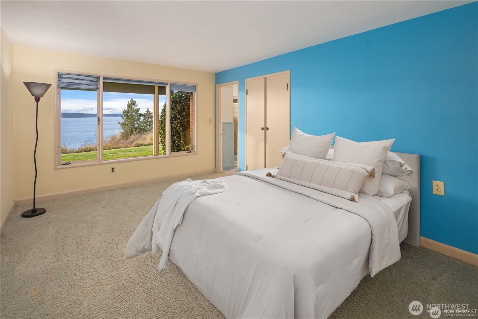 727 Southwest 199th Place Normandy Park, WA 98166 - Photo 25 of 38 a large bed sitting in a bedroom next to a window