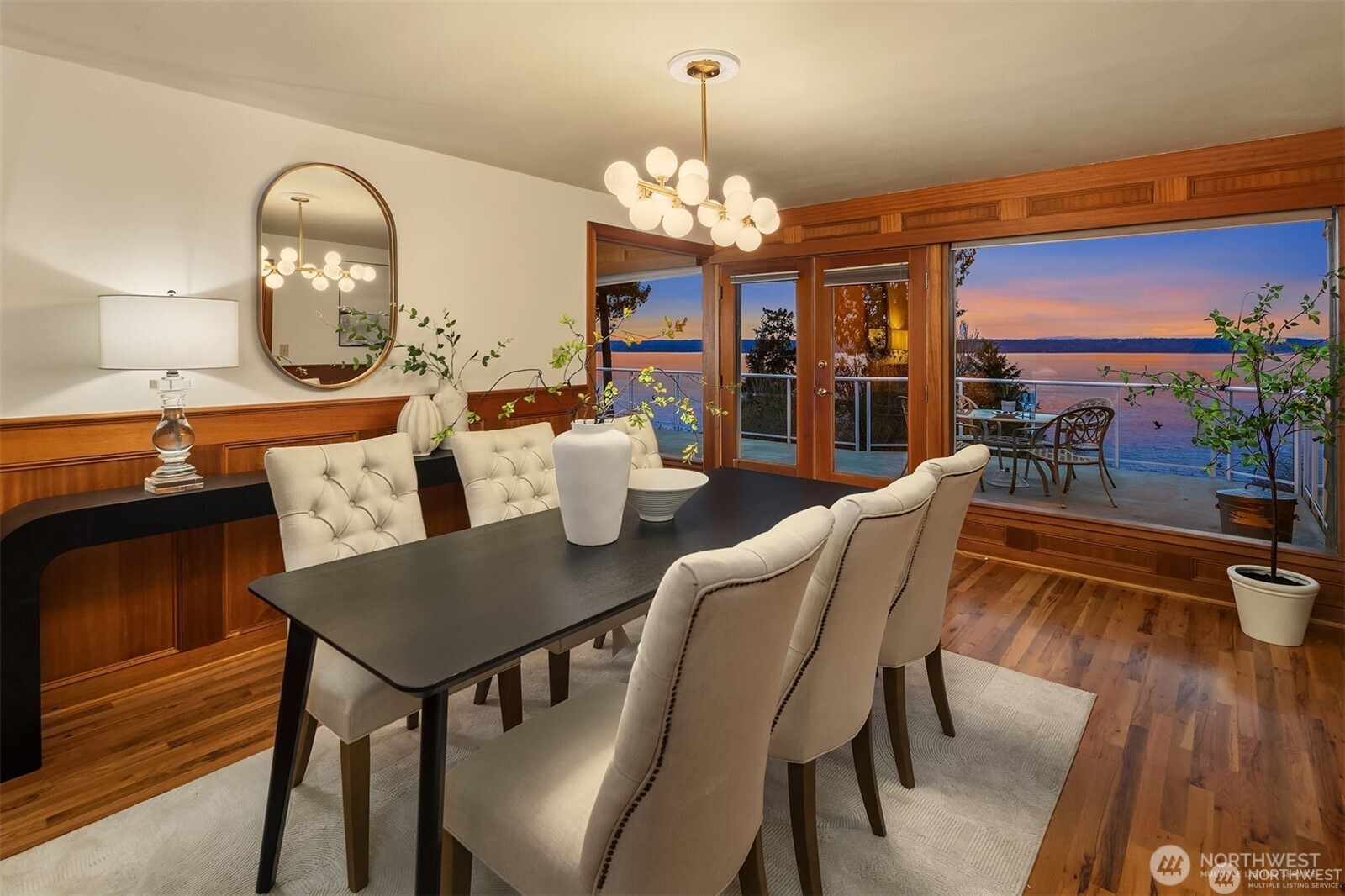 727 Southwest 199th Place Normandy Park, WA 98166 - Photo 10 of 38 a dining room with furniture a chandelier and wooden floor