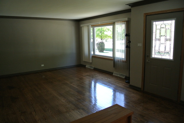 10549 Oak Park Avenue Chicago Ridge, IL 60415 - Photo 7 of 25 a view of wooden floor and windows in an empty room