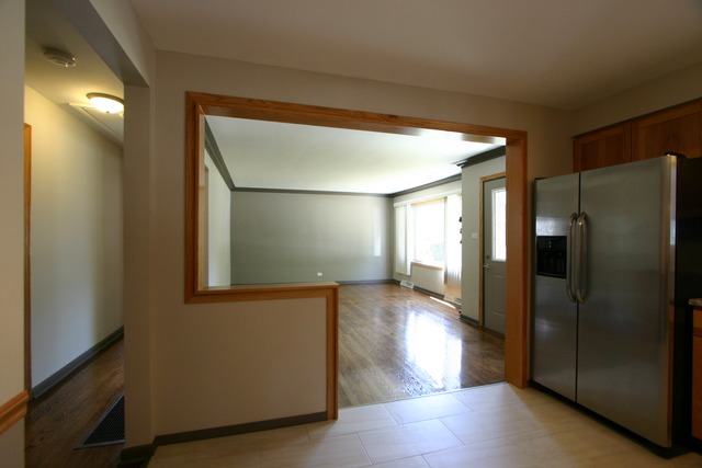 10549 Oak Park Avenue Chicago Ridge, IL 60415 - Photo 9 of 25 a view of a hallway with wooden floor