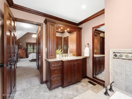 a bathroom with a sink and mirror