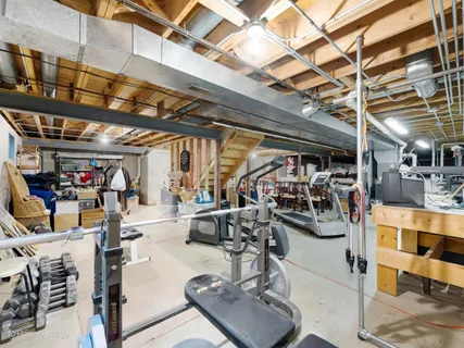 a view of backyard with outdoor seating and trees