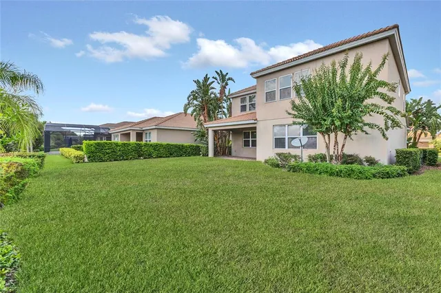 a view of house with a yard
