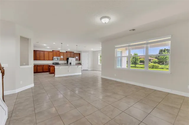 a view of a kitchen with furniture and a window