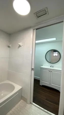 a room with cabinets and wooden floor