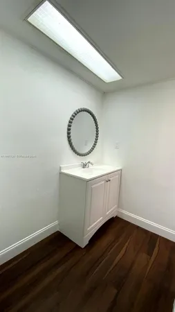 a bathroom with a sink and vanity