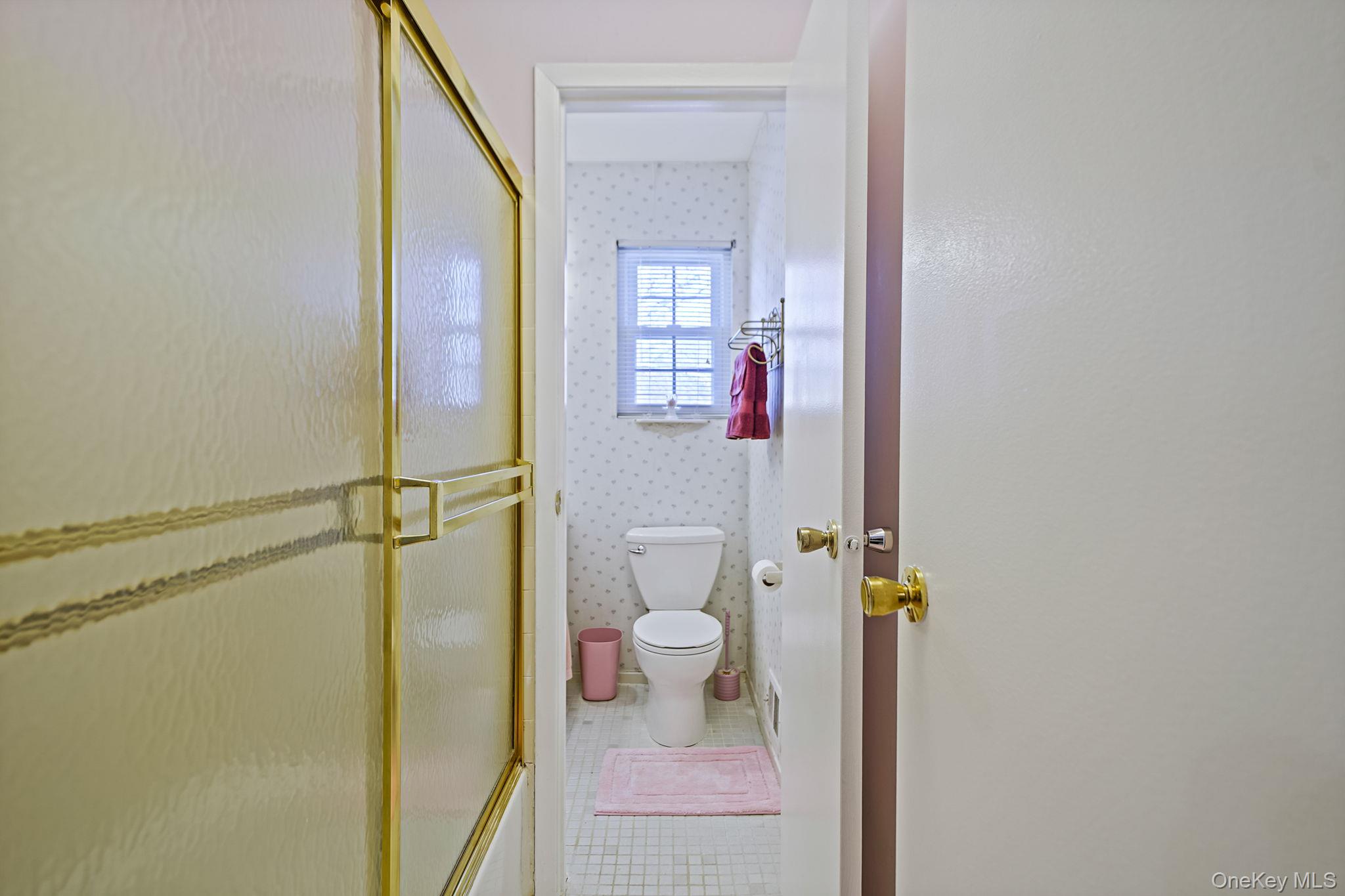 8 Huntington Commons, Unit 8 Yaphank, NY 11980 - Photo 17 of 30 a bathroom with a granite countertop shower and a toilet