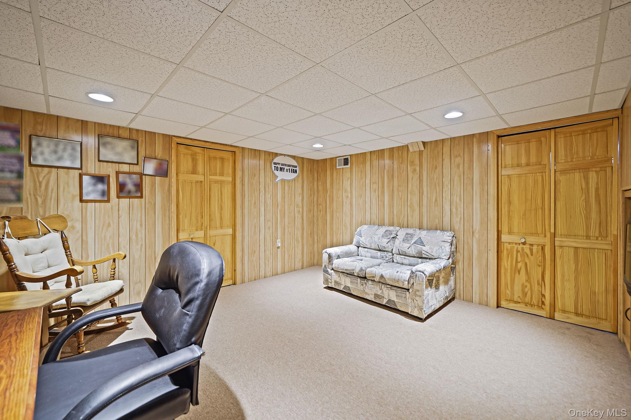 8 Huntington Commons, Unit 8 Yaphank, NY 11980 - Photo 24 of 30 a room with furniture and a window