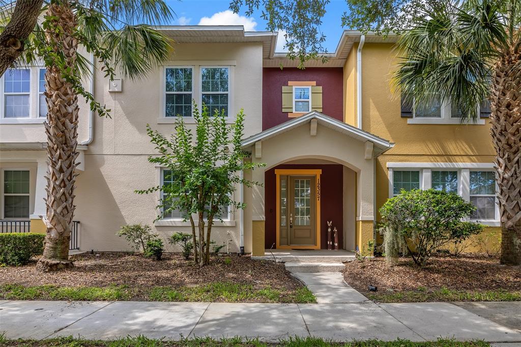 12357 Via Derna Place Windermere, FL 34786 - Photo 2 of 33 a front view of a house with garden