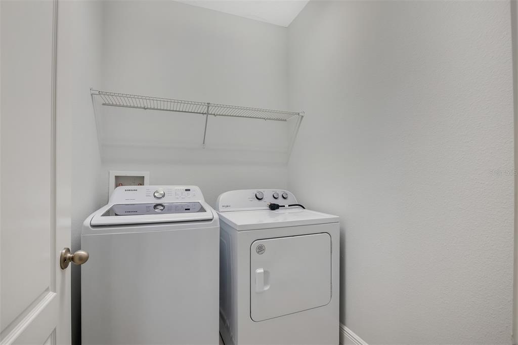 12357 Via Derna Place Windermere, FL 34786 - Photo 21 of 33 a utility room with dryer and washer