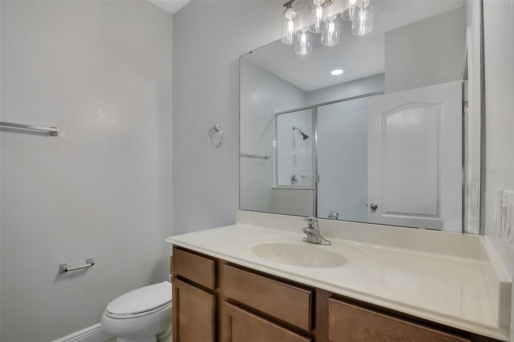 12357 Via Derna Place Windermere, FL 34786 - Photo 22 of 33 a bathroom with a sink a toilet and shower