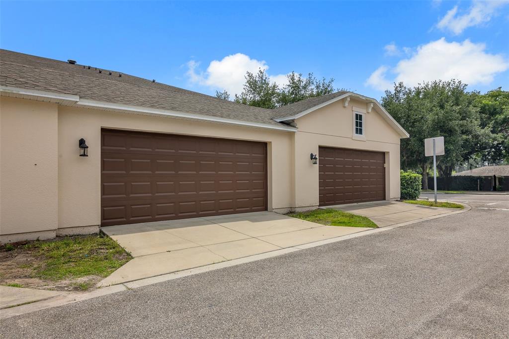 12357 Via Derna Place Windermere, FL 34786 - Photo 26 of 33 a front view of a house with a garage