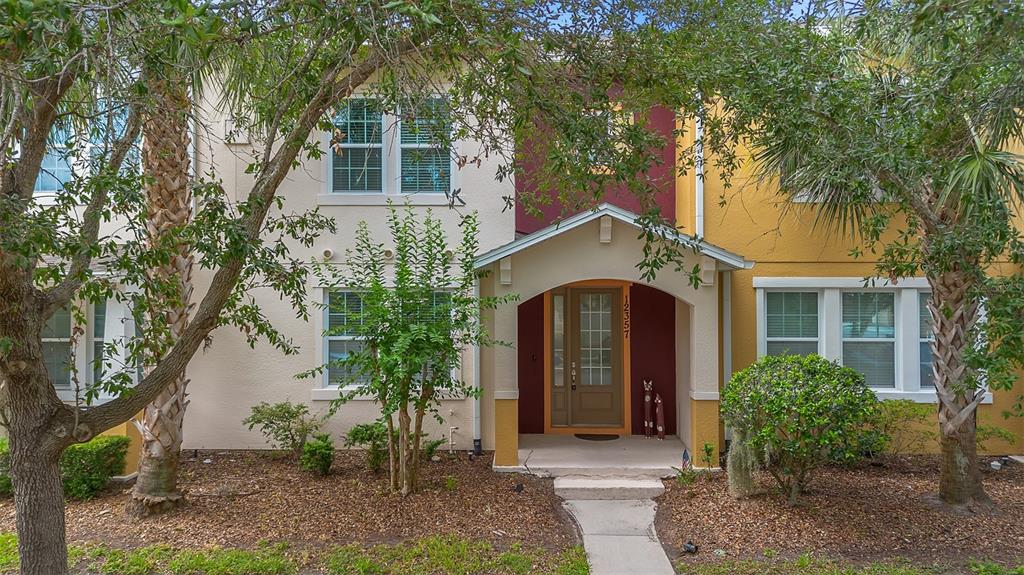 12357 Via Derna Place Windermere, FL 34786 - Photo 27 of 33 a front view of a house with garden