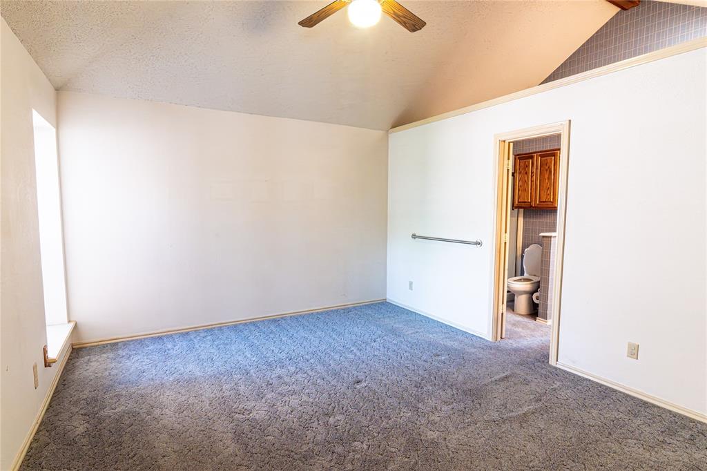 2028 Falcon Ridge Drive, Unit B Carrollton, TX 75010 - Photo 10 of 11 Unfurnished bedroom featuring carpet, a ceiling fan, and ensuite bathroom
