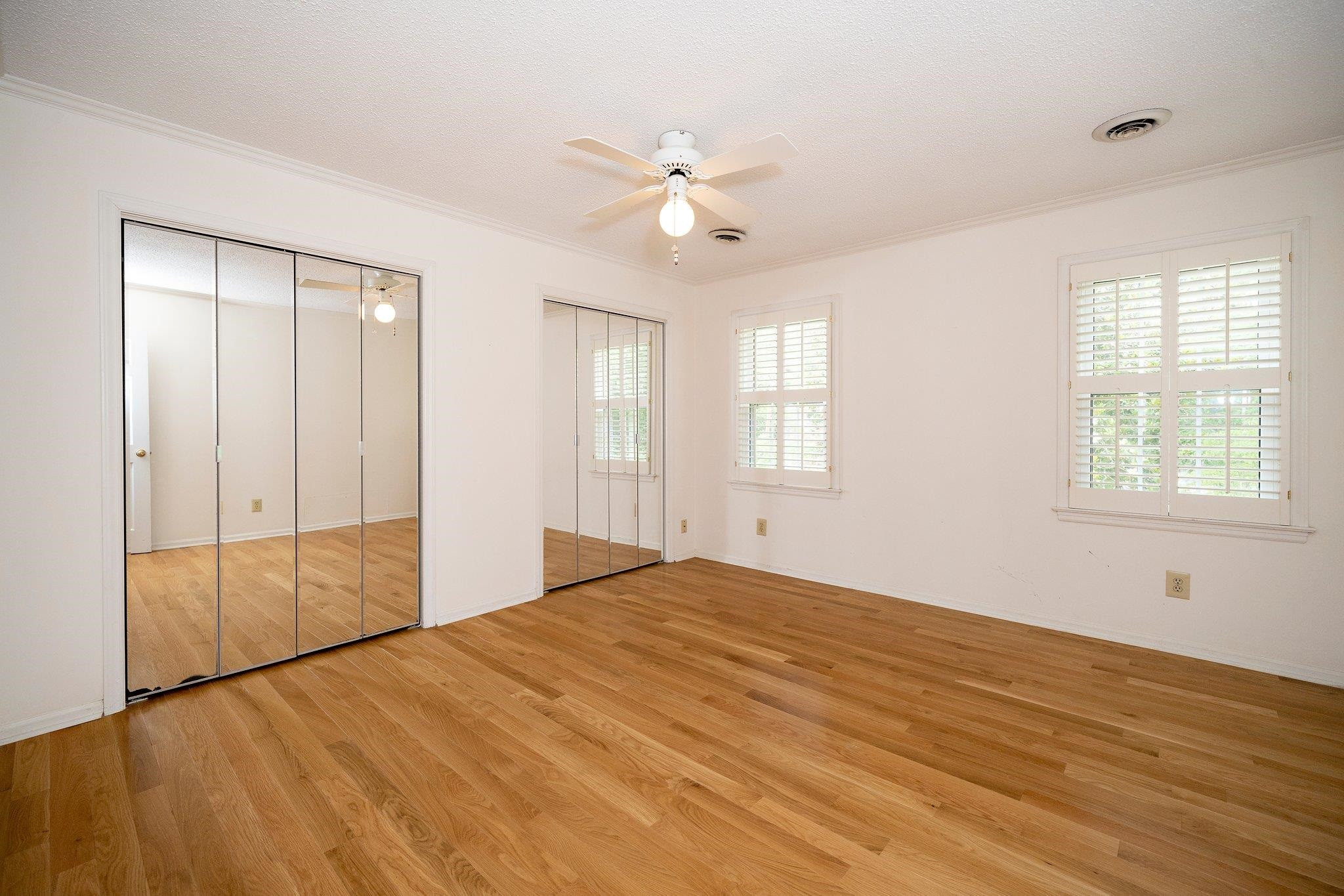 1512 Pony Run Road Raleigh, NC 27615 - Photo 24 of 39 Secondary 2nd Floor Bedroom has Two Mirrored Double Closets, Solid Hardwood Floors, Ceiling Fan and Plantation Shutters Secondary Bedroom