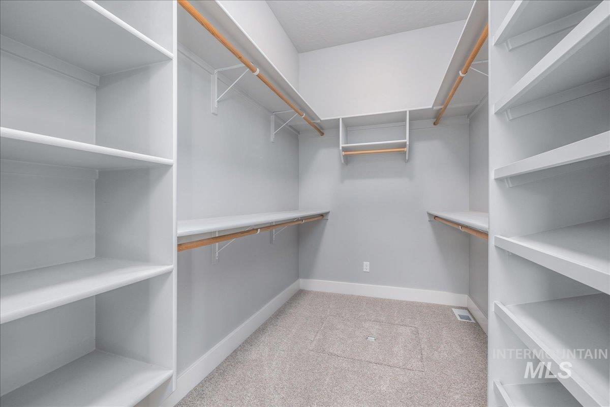 3036 Northwest 13th Street Meridian, ID 83646 - Photo 29 of 50 Walk in closet with light colored carpet