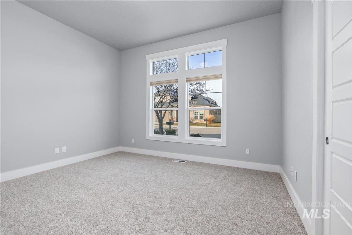 3036 Northwest 13th Street Meridian, ID 83646 - Photo 31 of 50 Spare room featuring light carpet and baseboards