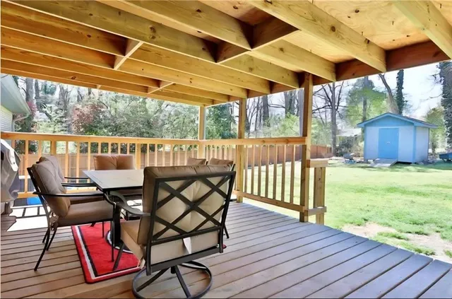 a view of a chairs and table in the deck