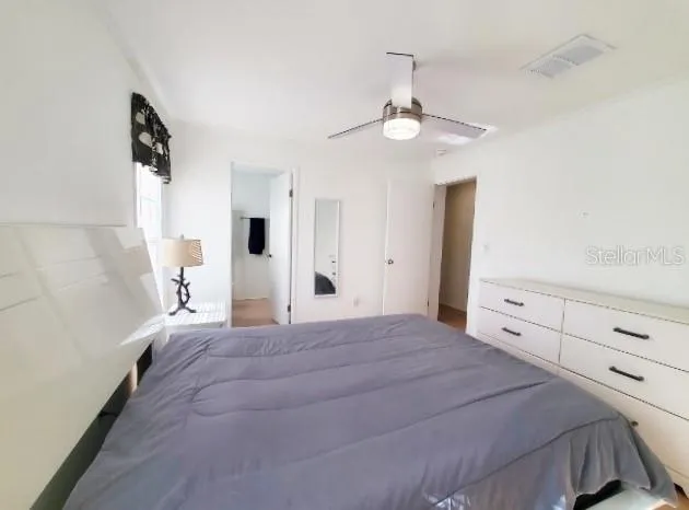 a large white bed in a white room