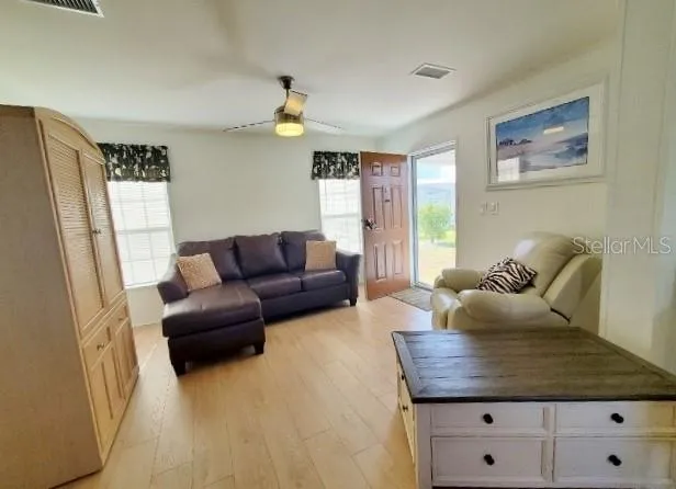 a living room with furniture and a window