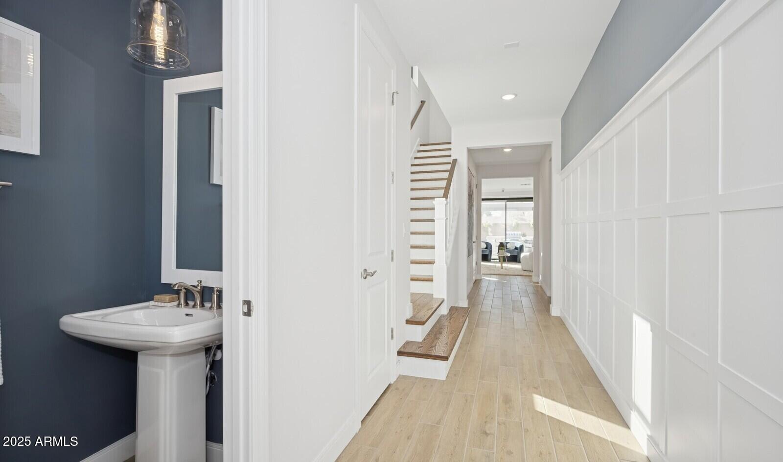 8027 West Royal Palm Road Peoria, AZ 85345 - Photo 9 of 33 a bathroom with a sink a mirror and a shower