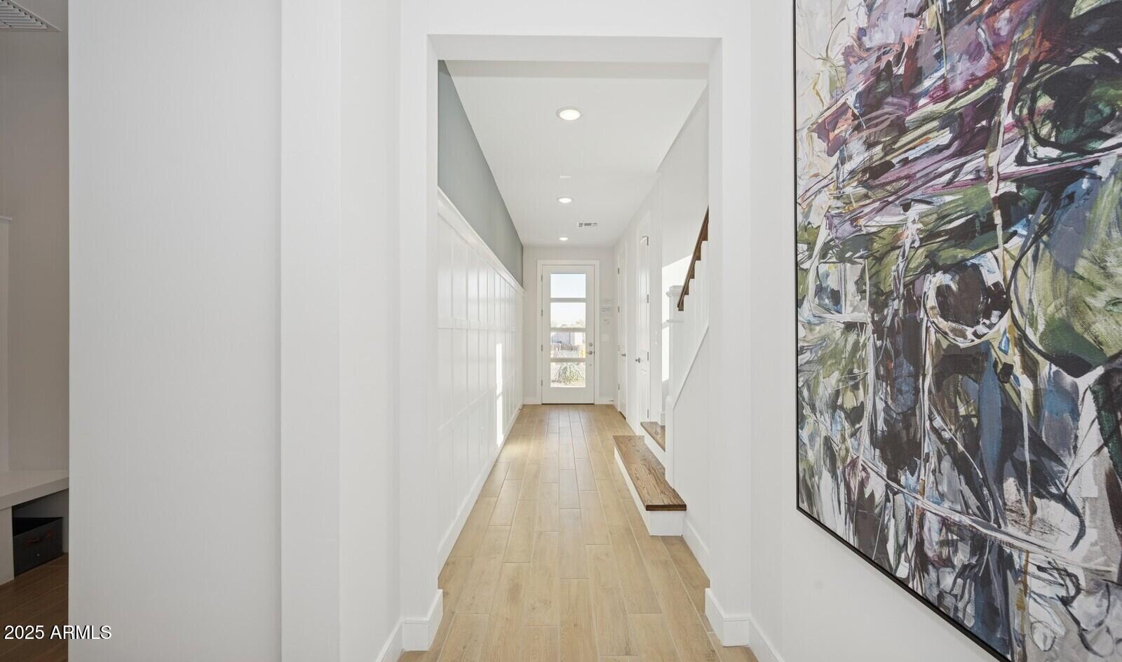 8027 West Royal Palm Road Peoria, AZ 85345 - Photo 14 of 33 a view of a hallway with wooden floor and entryway