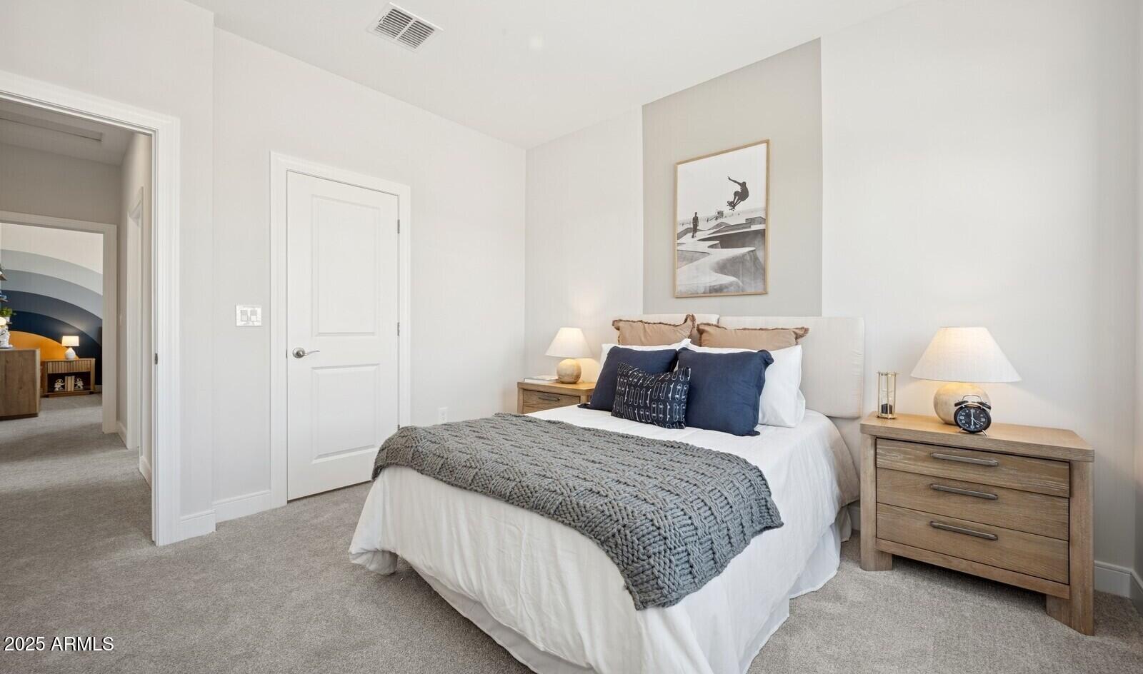 8027 West Royal Palm Road Peoria, AZ 85345 - Photo 24 of 33 a bedroom with a bed and a lamp