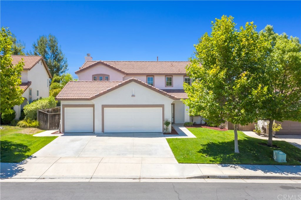 33187 Fox Road Temecula, CA 92592 - Photo 1 of 1 a front view of a house with a yard and trees