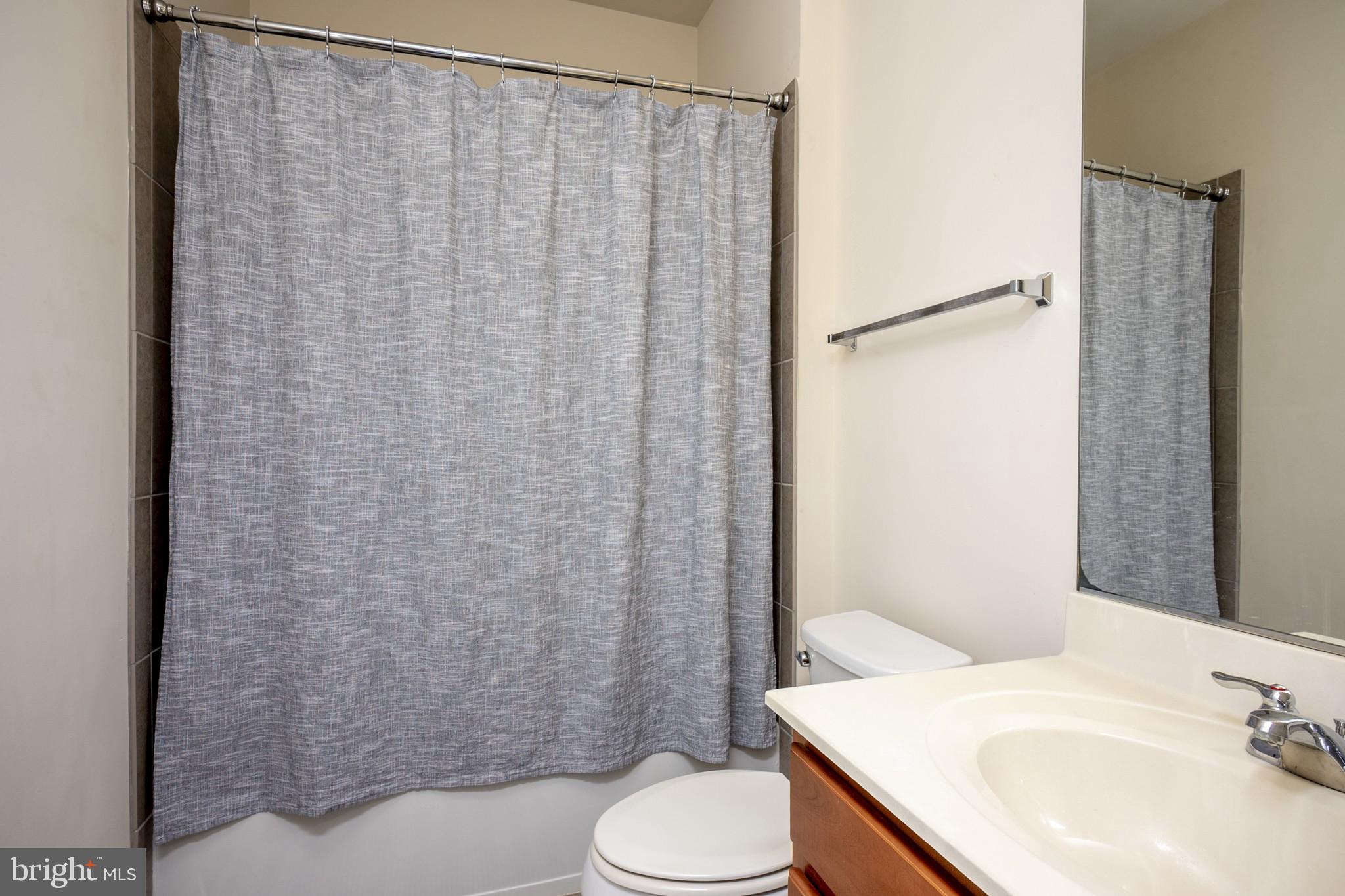 2703 Swann Wing Court Lanham, MD 20706 - Photo 11 of 36 a bathroom with a sink and toilet
